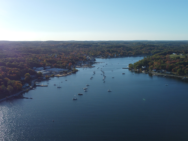 Vessel approaching Mahone Bay under sail